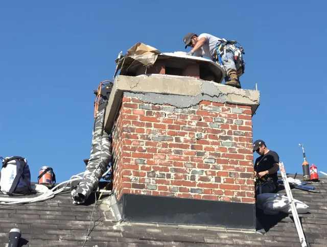 Hanson Chimney Sweep installing a custom chimney crown in Hanson, MA