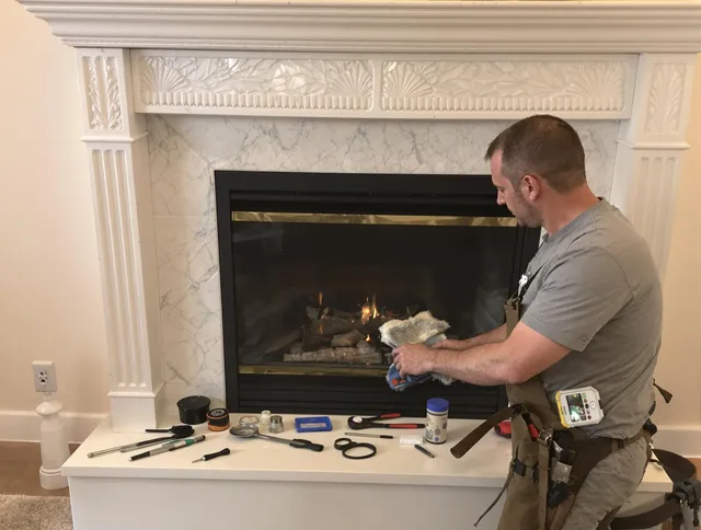 Hanson Chimney Sweep performing fireplace maintenance in Hanson, MA